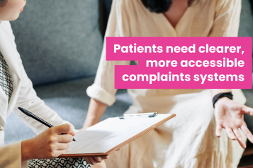 A photo of two women speaking, they are sat down and their faces are out of frame. One woman in professional clothes holds a clipboard and makes notes as the other speaks. Overlaid text reads 'patients need clearer more accessible complaints systems'